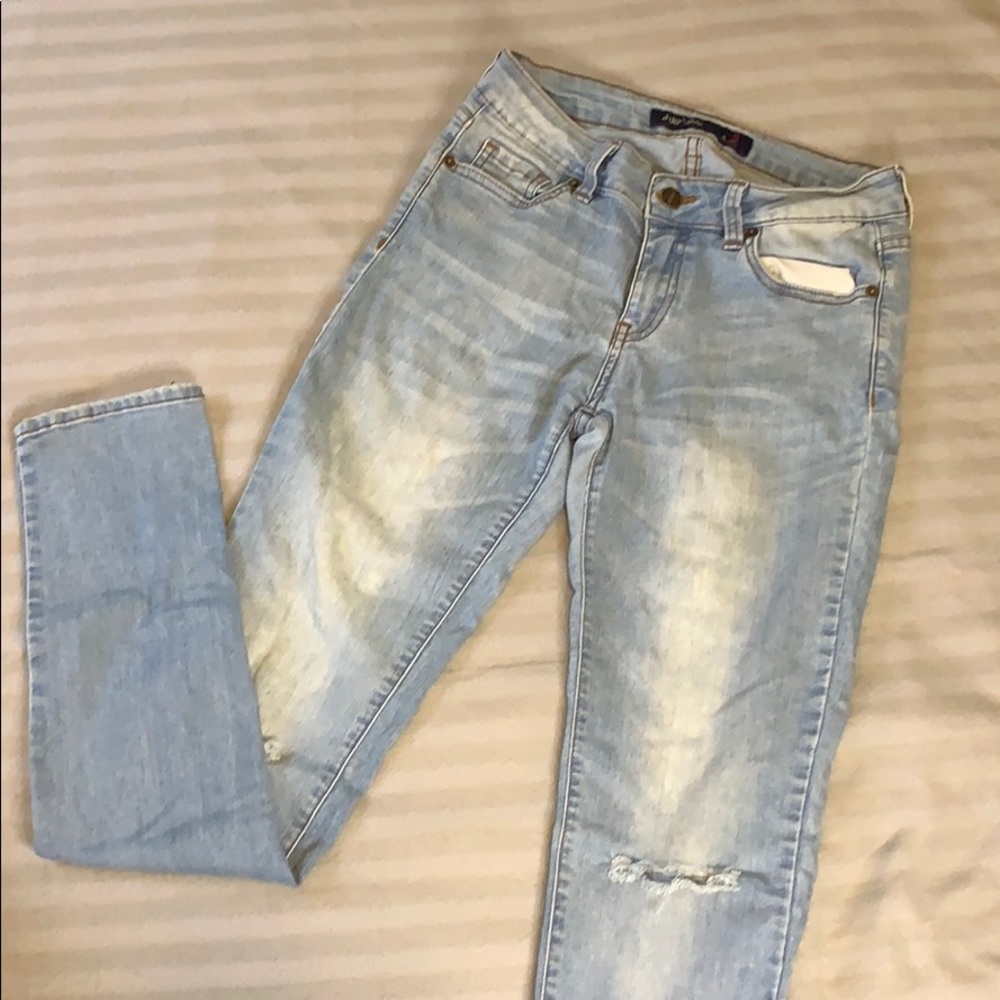 Blue jeans with slit at knee level